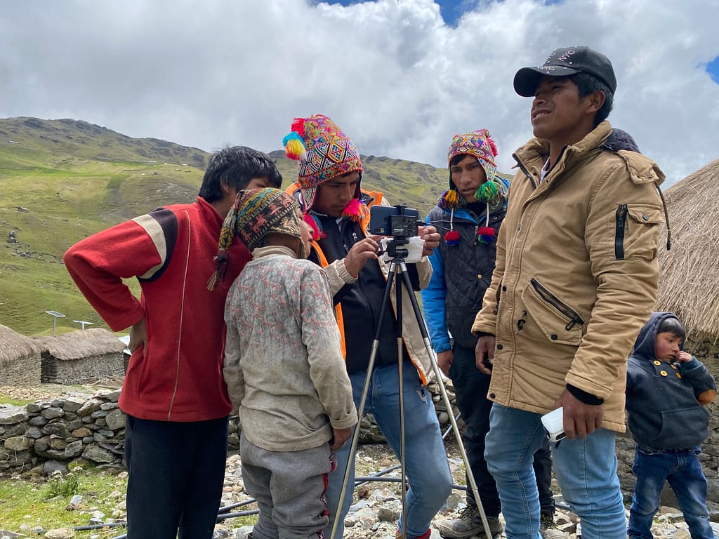 Peruvian youth looking at a camera