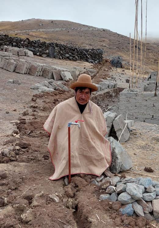 Bernabe near a water spigot